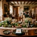 Traditional Irish dining table centerpiece with moss and taper candles for St Patricks Day