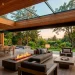 Luxury covered patio with seamless flat glass skylight and modern outdoor lounge furniture at golden hour.