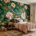 Oversized pink and green floral wallpaper mural in a stylish kids bedroom with a vintage brass bed.