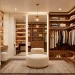 Luxurious small dressing room transformation with custom wood shelving and soft lighting.