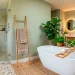 Luxury master bathroom decorated like a serene spa oasis with natural wood elements and soft lighting.