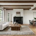 Bright modern farmhouse living room with a sleek white sofa and rustic reclaimed wood coffee table