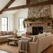 Cozy modern farmhouse living room with holiday decor, stone fireplace, and neutral linen furniture.