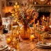 Cozy Thanksgiving dining table styled with warm amber glass goblets, vases, and soft flickering candles.