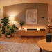 Cozy modern apartment interior featuring subtle smart lighting and a minimalist smart speaker on a wooden table