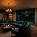Sophisticated dark charcoal painted living room with velvet seating and warm ambient lighting.
