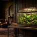 Elegant Victorian glass Wardian case displaying rare specimens on a modern table in a moody room