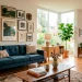 Modern living room featuring a perfectly aligned gallery wall above a mid-century sofa with natural sunlight.