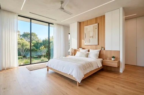 Bright minimalist bedroom featuring smart hidden storage solutions, built-in wardrobes, and a serene clutter-free aesthetic.