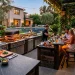 Luxury outdoor kitchen with dark natural stone countertops and built-in grill at sunset.