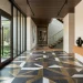 Contemporary entryway featuring bold geometric floor tiles in charcoal and brass
