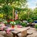 Beautifully styled backyard patio ready for a Memorial Day party with a decorated picnic table and string lights.