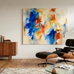 Mid century modern living room featuring a vibrant contemporary abstract painting and a walnut credenza.