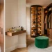 Cozy small dressing room featuring floor-to-ceiling wooden cubbies and a spinning shoe carousel.