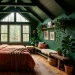 Wide view of a deep forest green attic bedroom with slanted wood ceilings, terracotta bedding, and ambient brass lighting