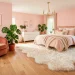 Plush ivory faux fur rug styled in a sunlit ultra-femme bedroom with blush pink walls and elegant gold decor.