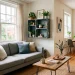 A cozy small living room featuring upcycled slate grey decor accents, wooden crate shelves, and natural lighting.