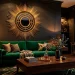 Luxurious living room featuring a large gold Art Deco sunburst mirror over an emerald green velvet sofa.