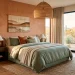 Earthy desert-inspired bedroom with terracotta walls and sage green linen bedding.