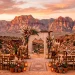 Beautiful boho desert wedding setup with terracotta and pampas grass at sunset.