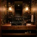 Luxurious hotel-inspired powder room with floating vanity and gold sconces