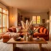 Cozy fall living room interior featuring warm terracotta sofa, earthy decor accents, and dried floral arrangements.