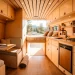 Custom wooden cabinetry inside a modern sprinter van conversion with open rear doors.