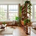 Beautifully zoned studio apartment layout featuring open shelving and distinct living and sleeping areas.