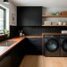 Edgy modern laundry room with matte black cabinets and wood accents