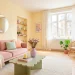 Bright Scandinavian studio apartment featuring soft Danish pastel room decor, blush sofa, and sunlit pastel accents.