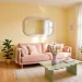 Bright Scandinavian studio apartment featuring soft Danish pastel room decor, blush sofa, and sunlit pastel accents.