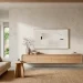 Minimalist Japandi living room featuring a raw wabi-sabi plaster TV wall and floating oak console.