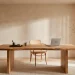 A serene Japandi style home office featuring a live-edge wooden desk, limewash walls, and soft natural sunlight.