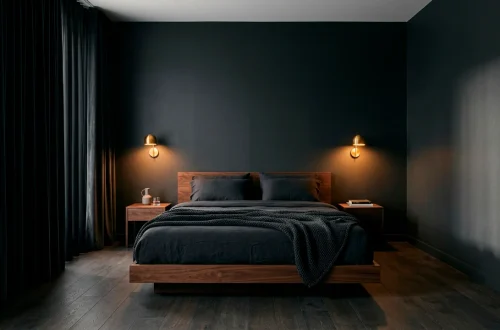 Dark moody minimalist bedroom with charcoal walls and warm amber lighting