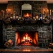 Moody Halloween fireplace decorated with witchy accents including black candles, apothecary bottles, and dried florals.