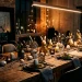 Modern industrial Easter table setting featuring dark styling, raw concrete eggs, and edgy metallic gold bunny decorations.