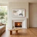 Minimalist living room with a styled plaster fireplace and a frame TV displaying abstract art
