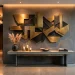 Large geometric metallic wall sculpture in an industrial glam entryway