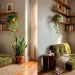 A styled small apartment corner with a floor cushion, tall plant, and floating shelves