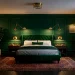 Luxurious moody bedroom featuring emerald green walls and brass wall sconces over a velvet bed.
