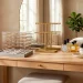 Beautifully organized light oak vanity table displaying various smart jewelry storage solutions.