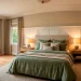 Wide view of a luxurious master bedroom featuring beautifully styled sage green linen bedding.