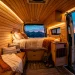 Luxurious modern custom van interior featuring smart home technology, glowing LED lights, and a view of mountains at twilight