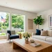 Modern living room featuring subtle Memorial Day decor and elegant oversized typography art hung above a linen sofa.