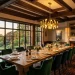 Luxurious dining room featuring a dark wood coffered ceiling and glowing modern chandelier over an oak table.