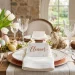 Luxurious Easter table setting with marble and copper place cards alongside fresh tulips and crystal glassware.