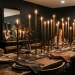 Oversized taper candles anchoring a beautifully styled modern dining table centerpiece with a moody glowing aesthetic.