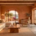 Earthy Mediterranean living room featuring terracotta plaster walls, an olive wood coffee table, and a cream linen sofa.