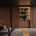 Discreet hidden home bar beautifully integrated into a fluted wood accent wall in a modern living room
