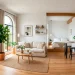 Bright and airy micro studio apartment flooded with natural sunlight and minimalist decor.